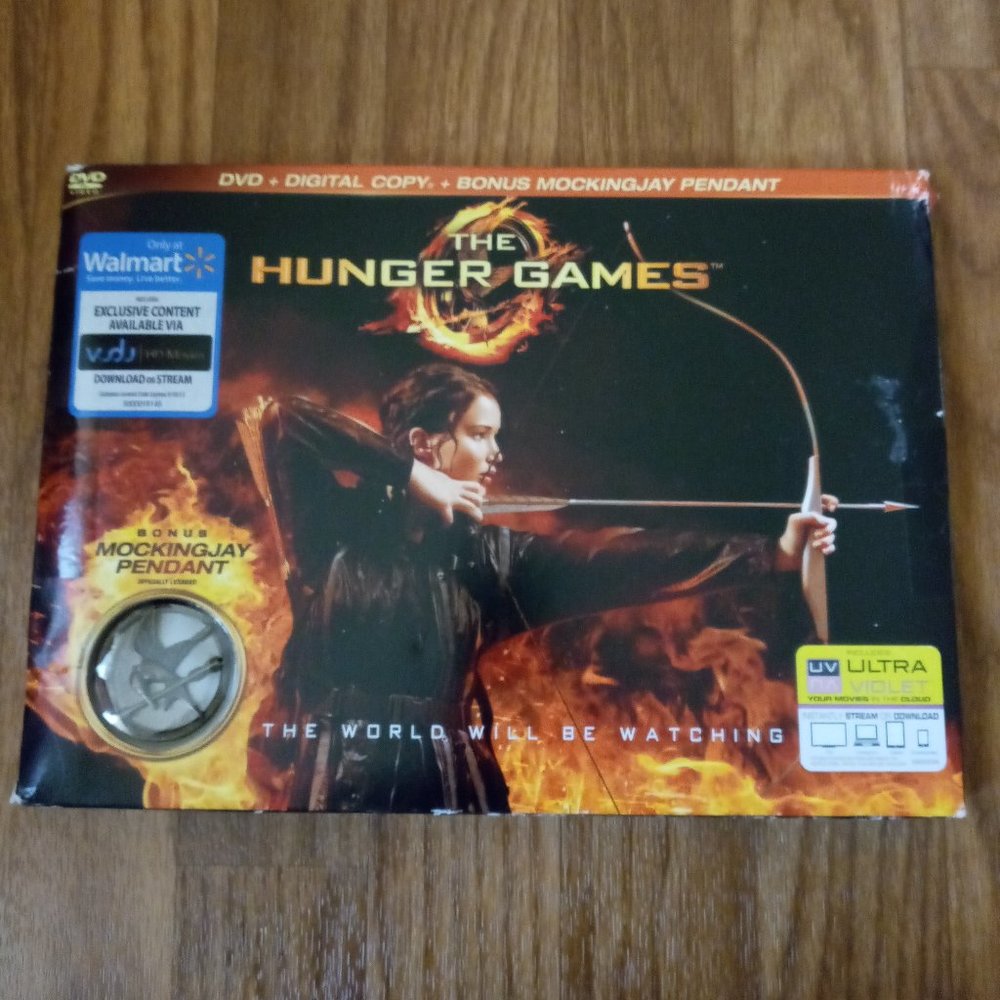 The Hunger Games DVD with bonus MockingJay Pendant  - open box NEW